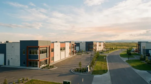 Modern business park in Calgary, Alberta under a wide sky, symbolizing opportunities for employers.