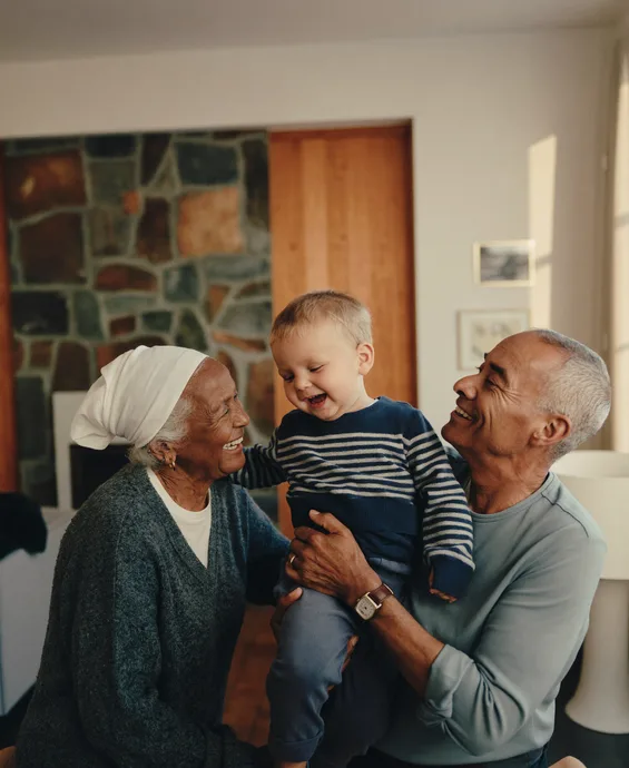 Three generations of a reunited family in their Canadian living room