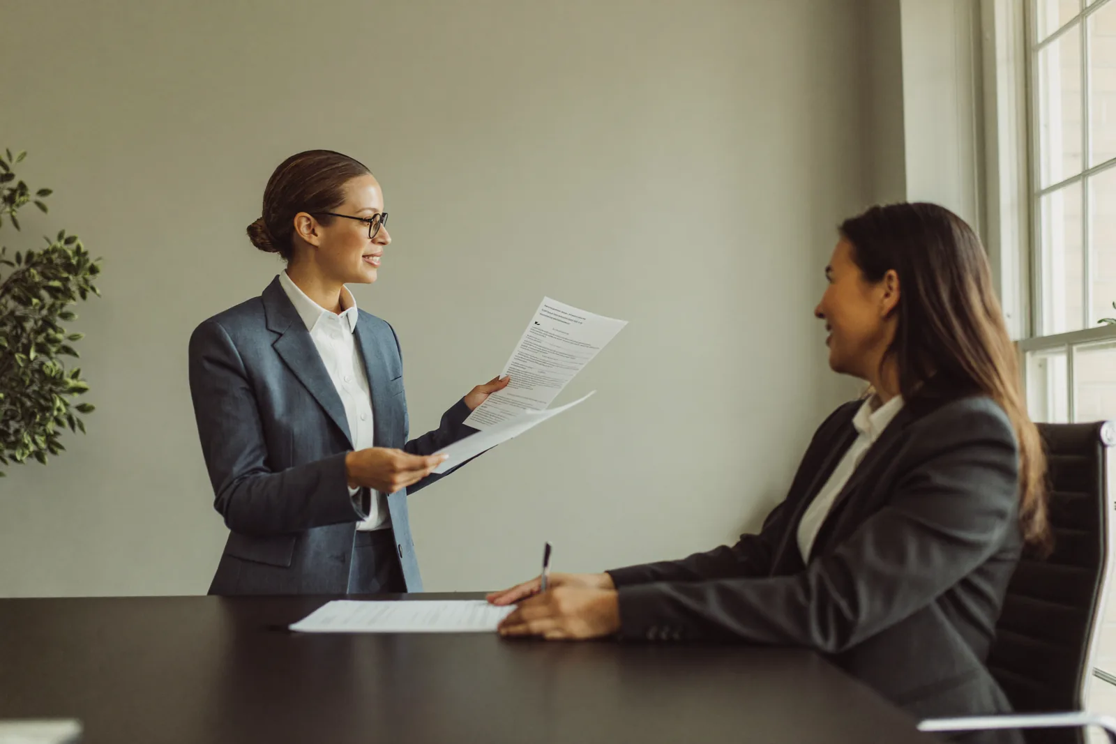 Employer discussing an LMIA application with a TopNation consultant in Edmonton