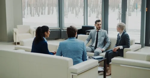Business professionals discussing immigration documents in modern office