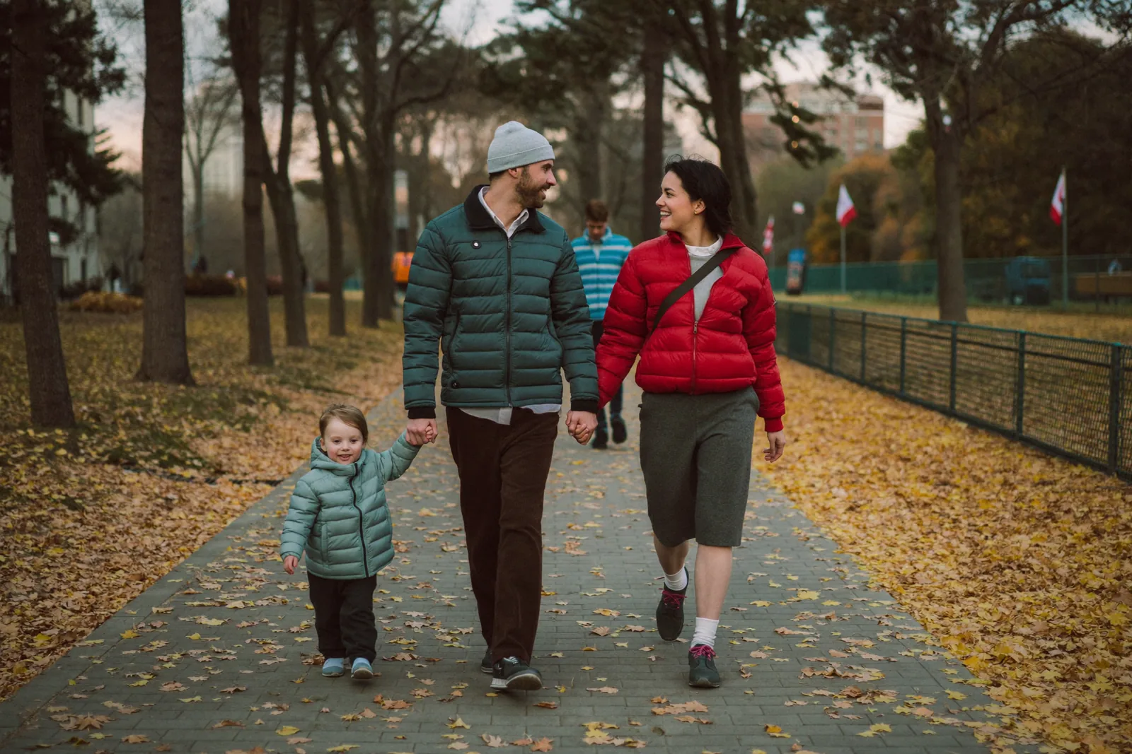 New Canadian family enjoying a city park after becoming citizens