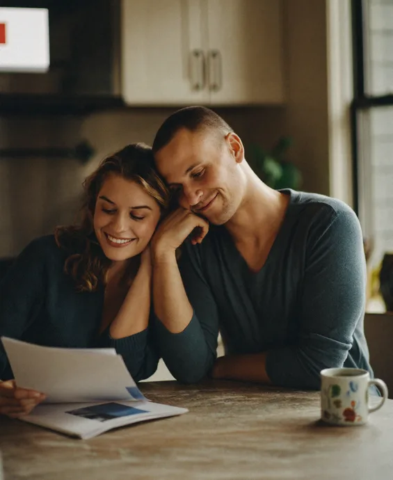 Couple reviewing their spousal sponsorship application together at home